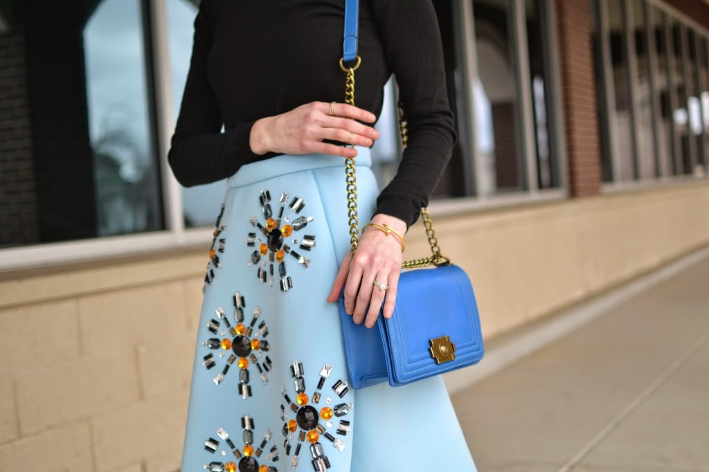 baby blue midi skirt, black turtleneck, black booties, Karen Walker Super Duper Sunglasses, blue purse, Honeybee jewelry 