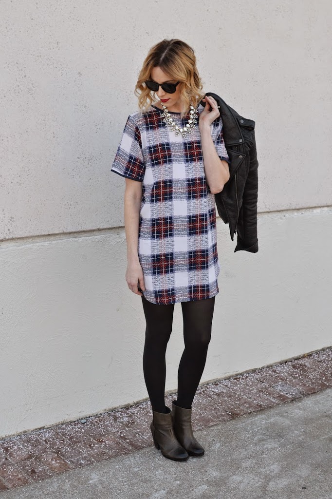 plaid shift dress, leather moto jacket, tights, boots, crystal necklace