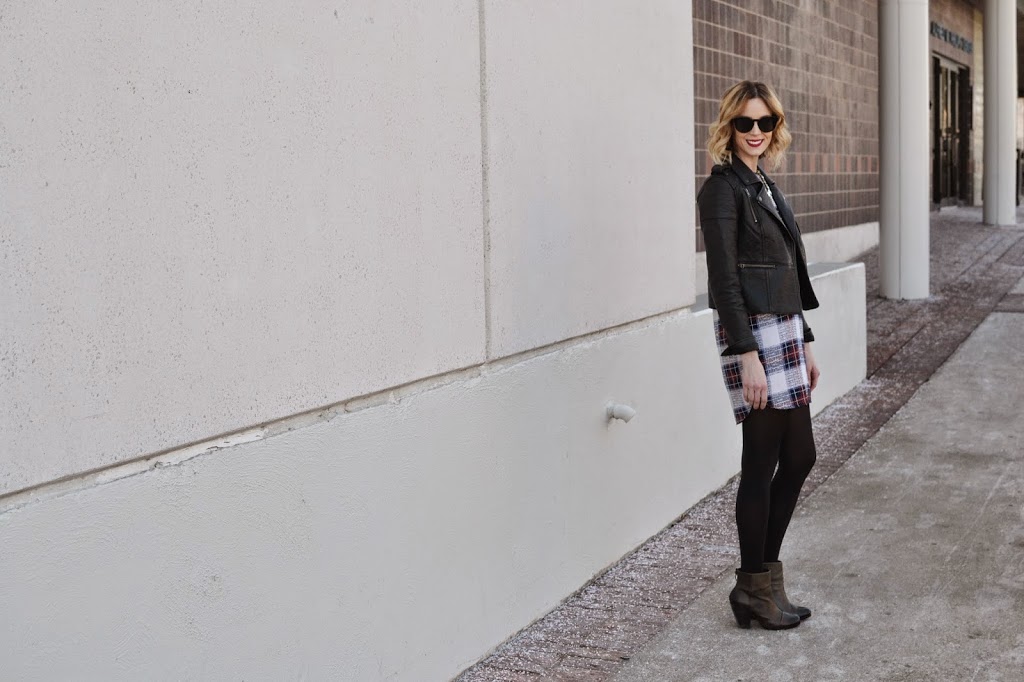 plaid shift dress, leather moto jacket, tights, boots, crystal necklace