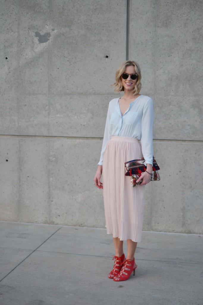 blush pleated midi skirt, pale blue blouse, red heeled sandals