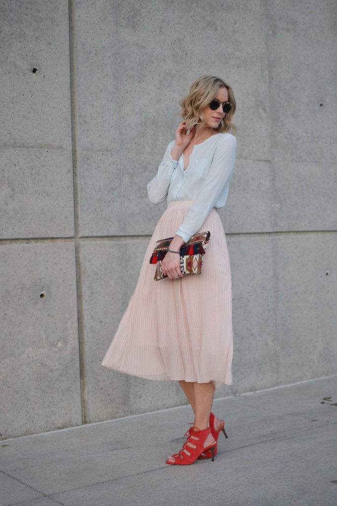 blush pleated midi skirt, pale blue blouse, red lace up heels
