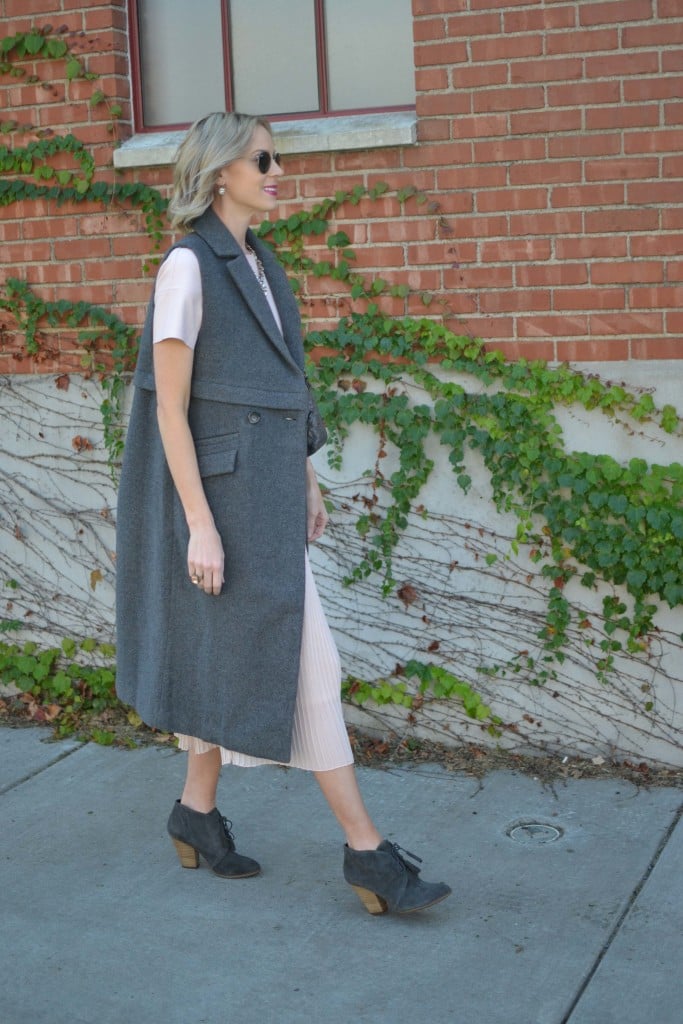 pink leather chicwish top, blush midi skirt, grey vest and booties, chloe + Isabel jewelry