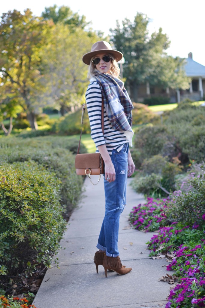 Striped top, plaid blanket scarf, hat, distressed jeans, chloe dupe bag, fringe booties