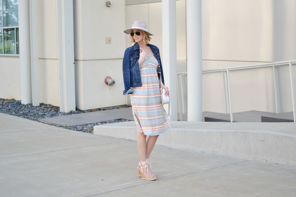 pastel striped dress, pale pink hat, summer outfit, lace up wedges, white tassel bag, jean jacket