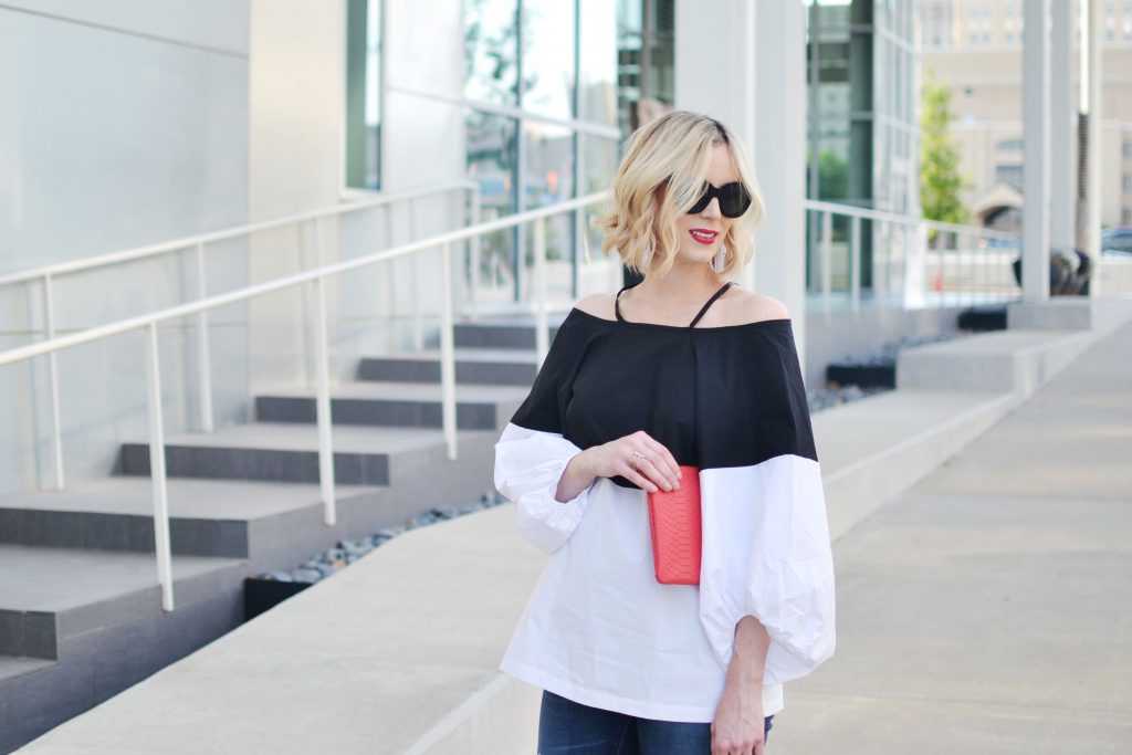 black and white cold color blocked cold shoulder top, distressed jean, red suede bow heels