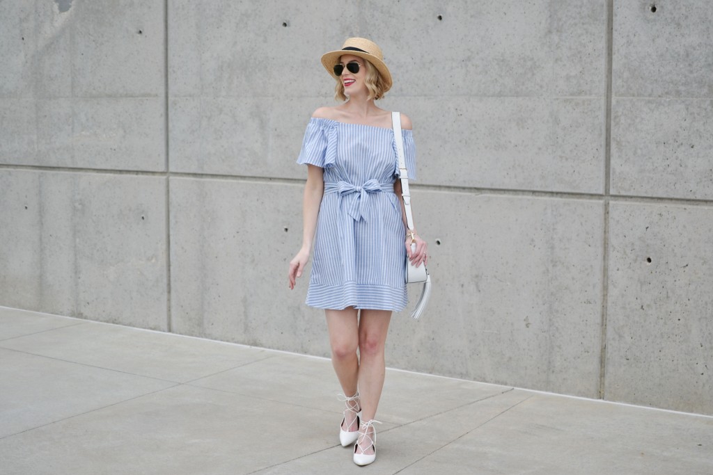 blue and white striped off the shoulder dress, white lace up flats, white tassel bag, star hat, red lip