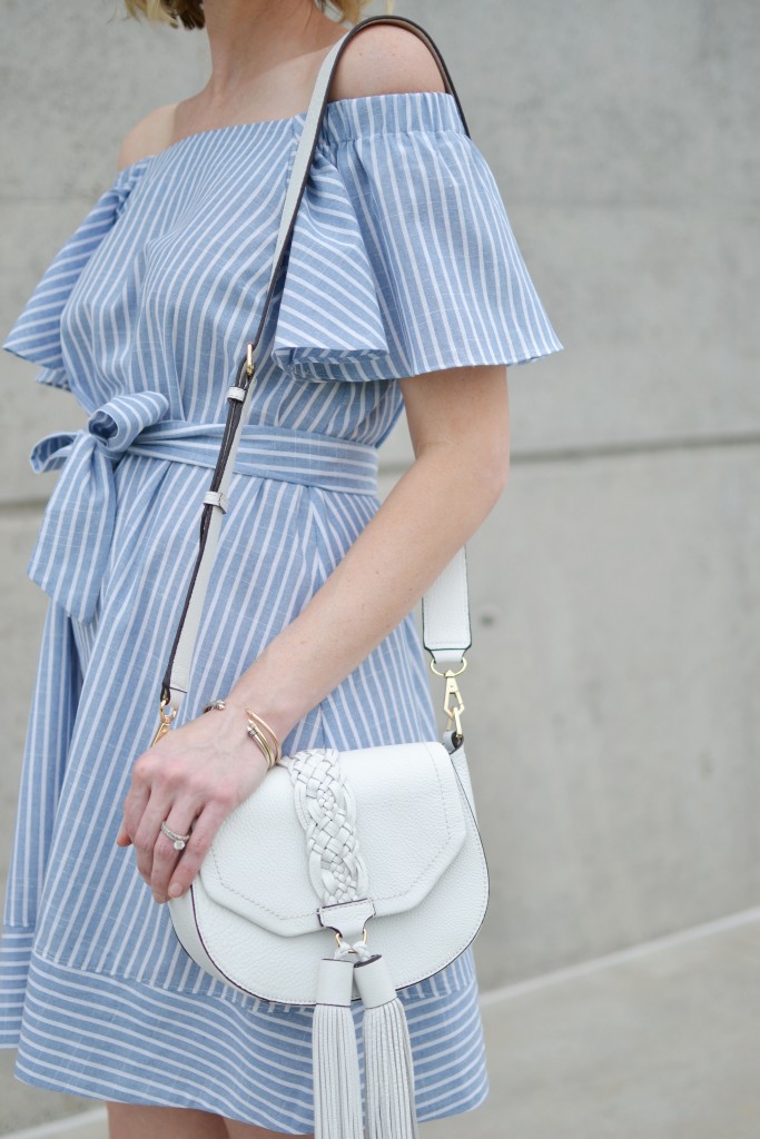 blue and white striped off the shoulder dress, white lace up flats, white tassel bag