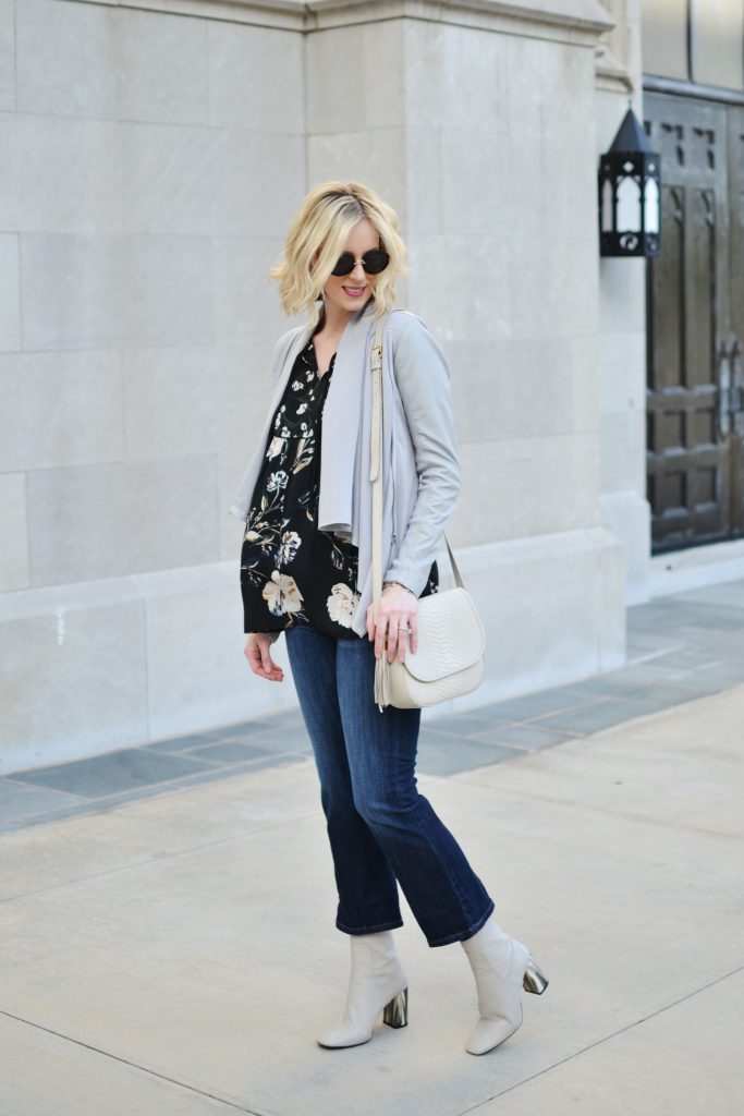 dark floral top, grey leather drape jacket, kick flare jeans, ankle booties