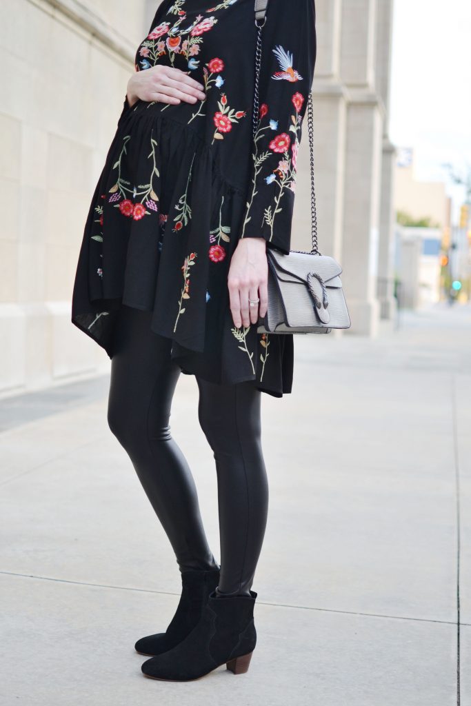 embroidered black tunic, faux leather leggings, black ankle booties, fall outfit idea, stylish maternity outfit