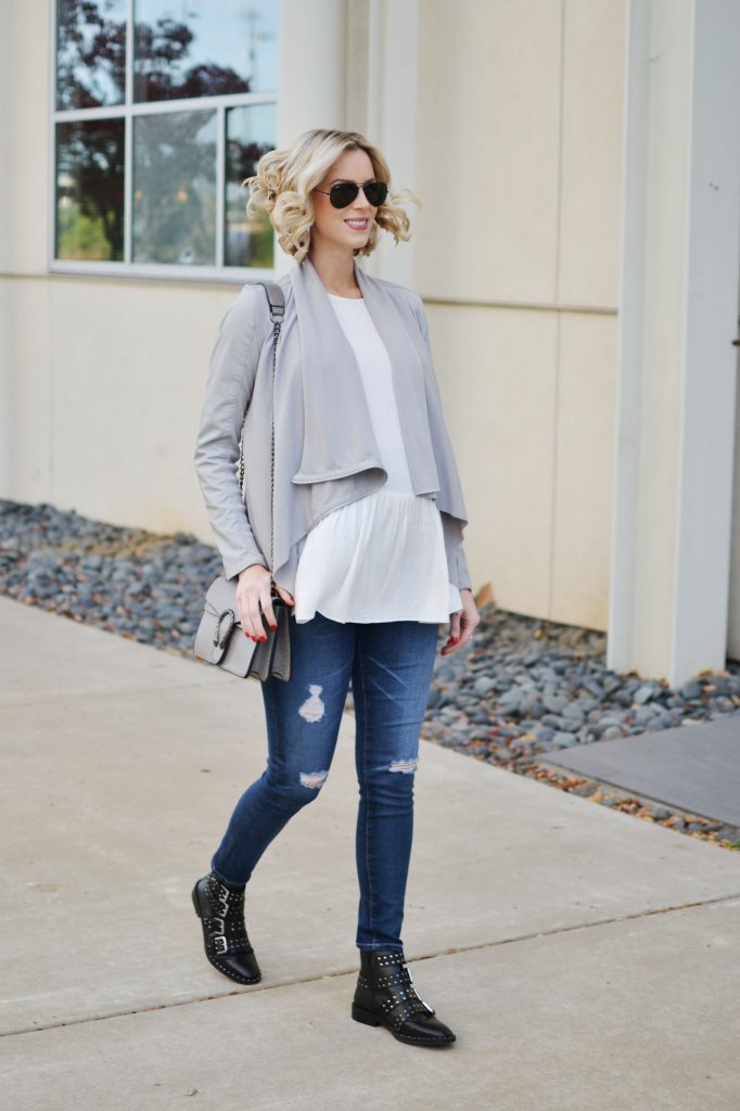easy casual outfit, draped leather jacket, white blouse, distressed denim, boots, stylish maternity outfit