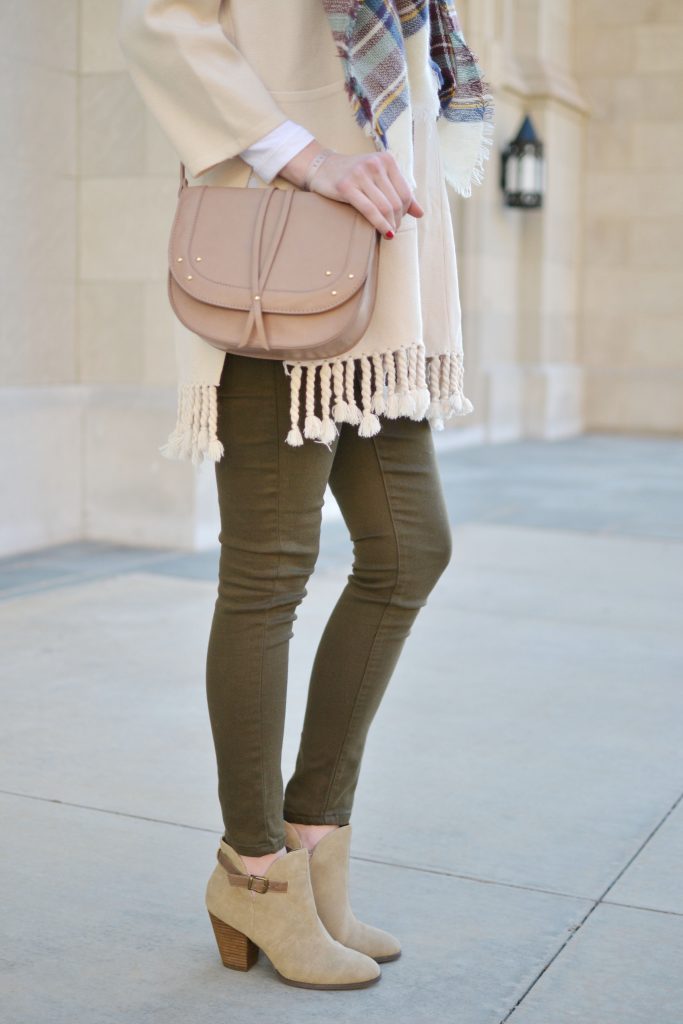 casual fall outfit idea, olive green skinny jeans, fringe cardigan, blanket scarf, Restricted Shoes booties