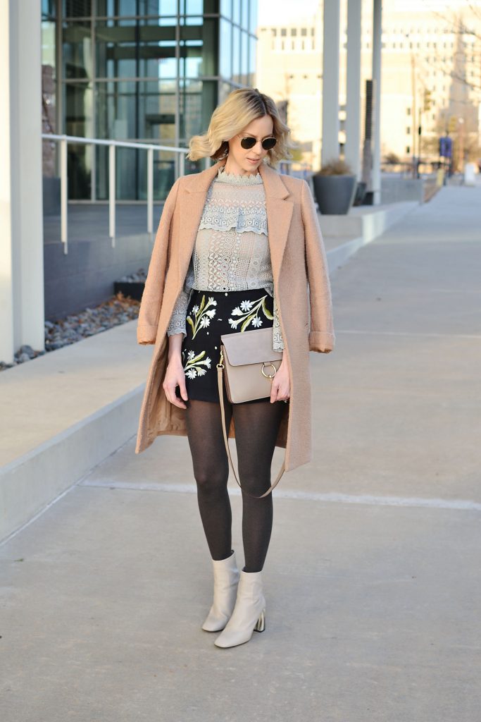 embroidered skirt and lace top with camel coat tights and boots, winter date night outfit idea