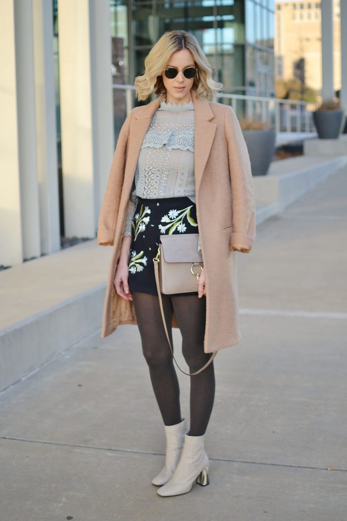 embroidered skirt and lace top with camel coat tights and boots, winter date night outfit idea
