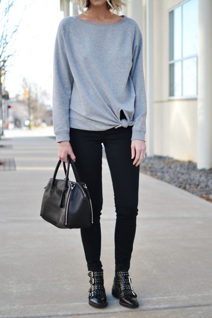 black and grey knotted grey sweatshirt, black jeans, buckle boots, casual jeans outfit