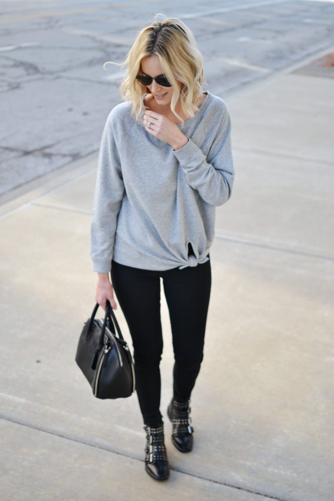 knotted grey sweatshirt, black jeans, buckle boots, casual jeans outfit
