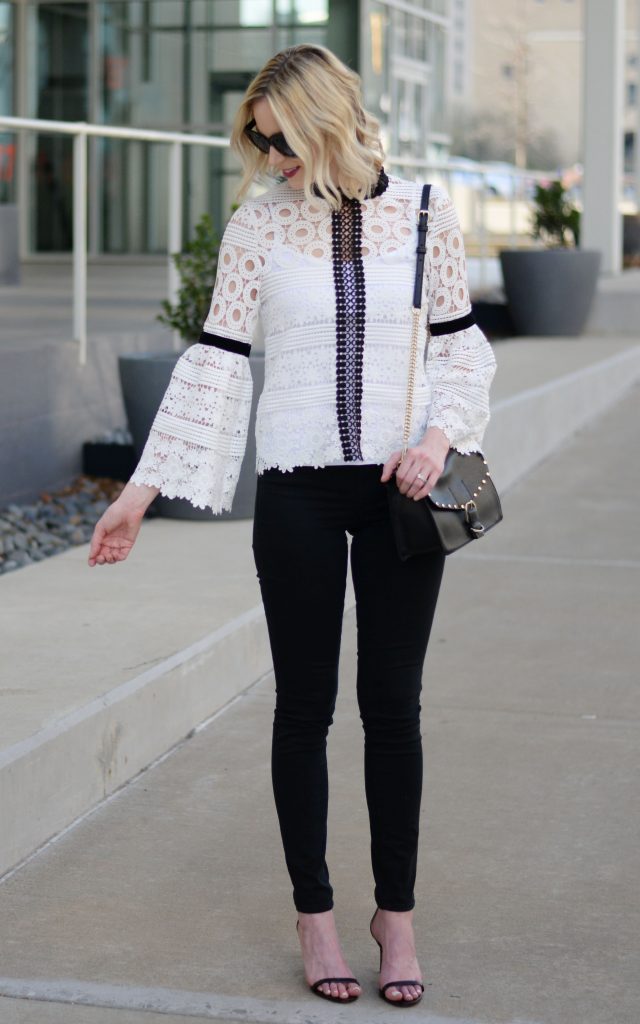 black and white lace top, black jeans, black heeled sandals