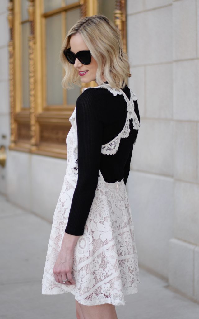 styling a backless dress, backless white lace dress, black tee