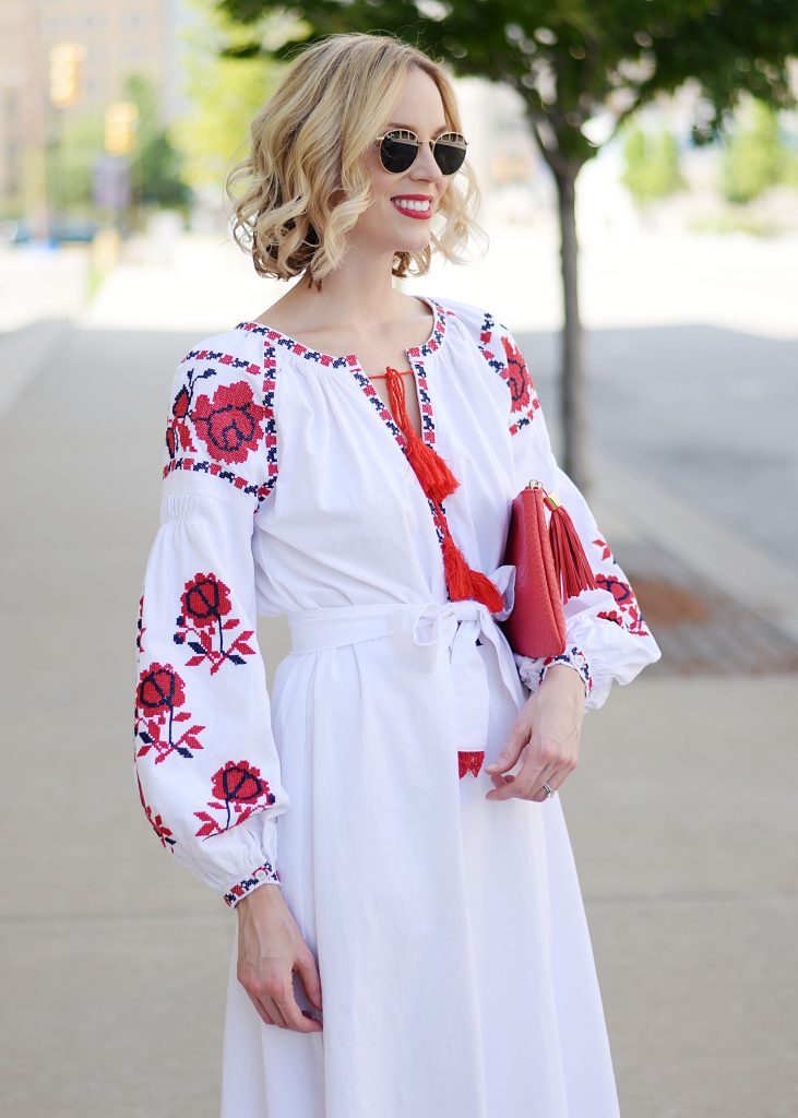 white and red embroidered midi dress with tassel tie closure