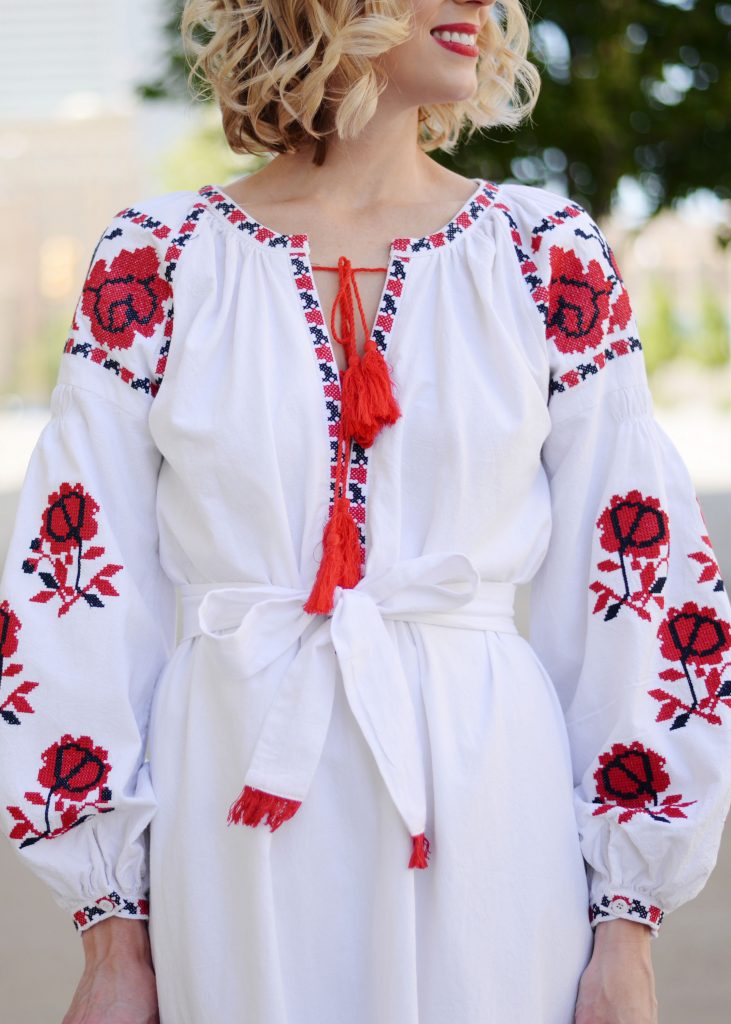 white and red embroidered midi dress with tassel tie closure