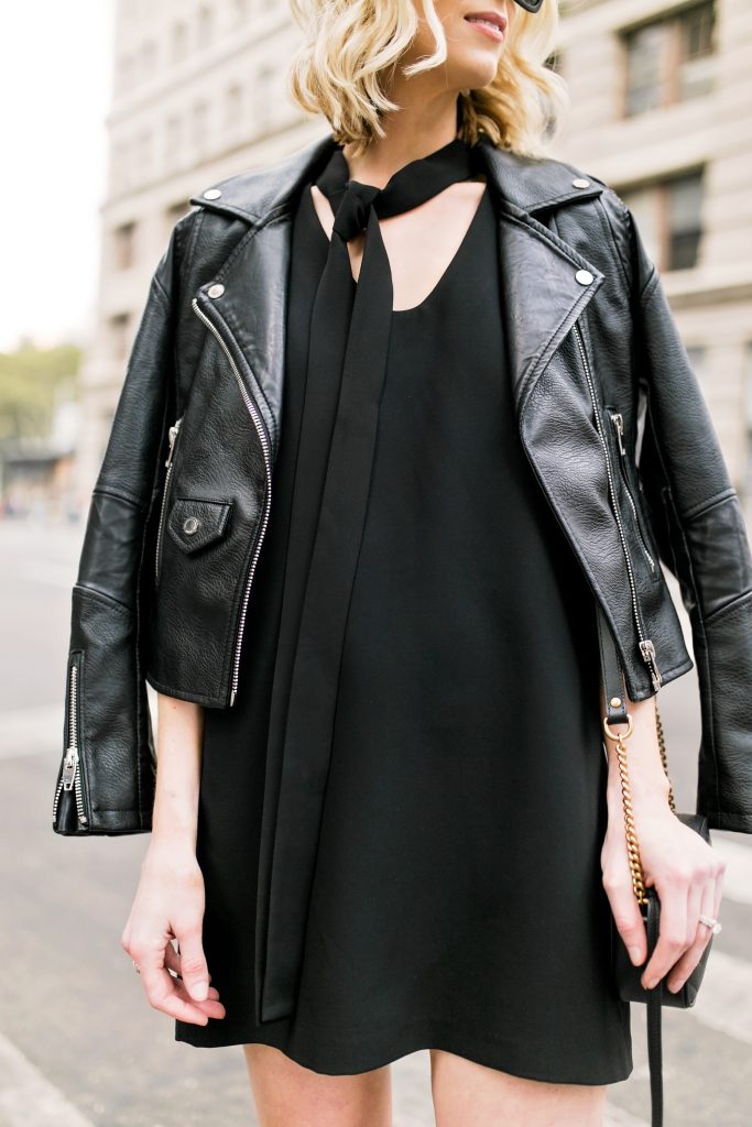 tie neck dress and black leather moto jacket