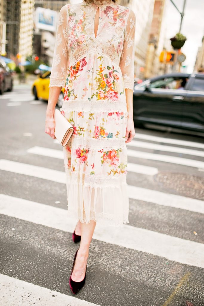 floral and lace midi dress with velvet heels and blush clutch, dressy outfit, street style photo