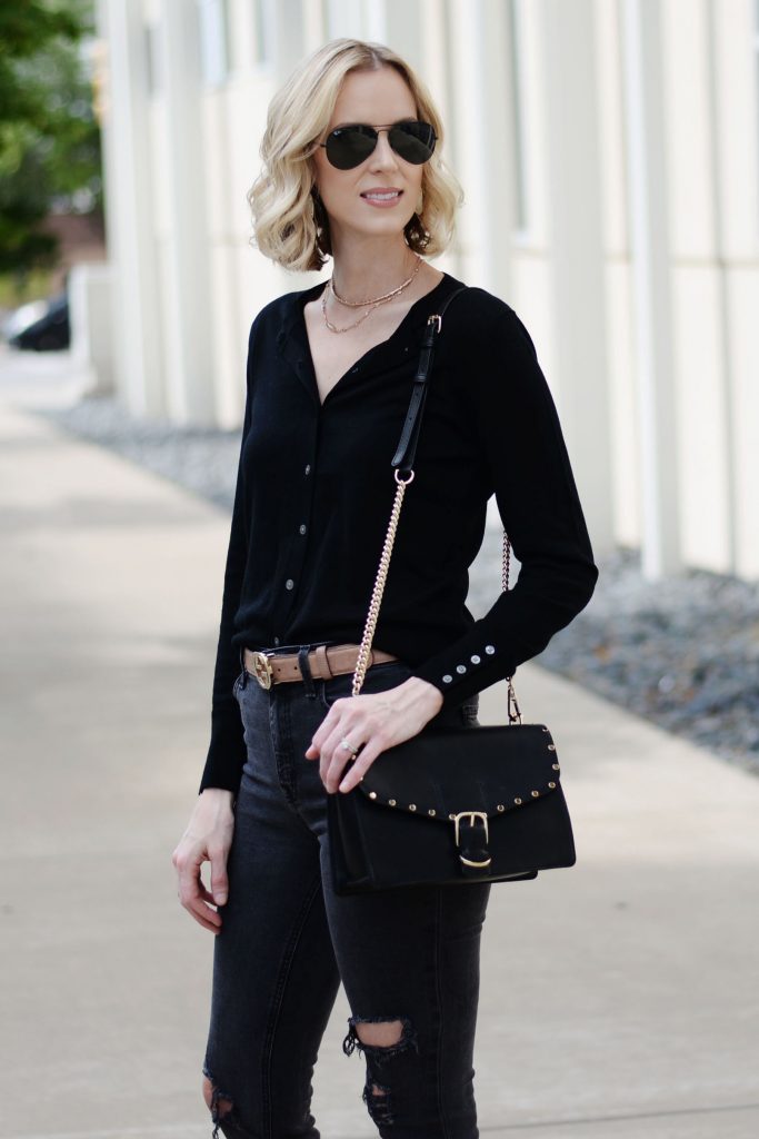 how to wear a cardigan as a top, all black outfit, gucci belt, distressed black jeans, black cardigan