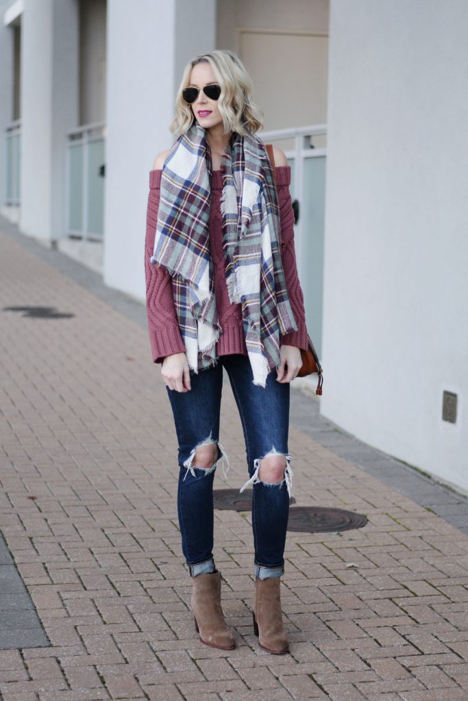 plaid blanket scarf with OTS sweater, ripped jeans, boots