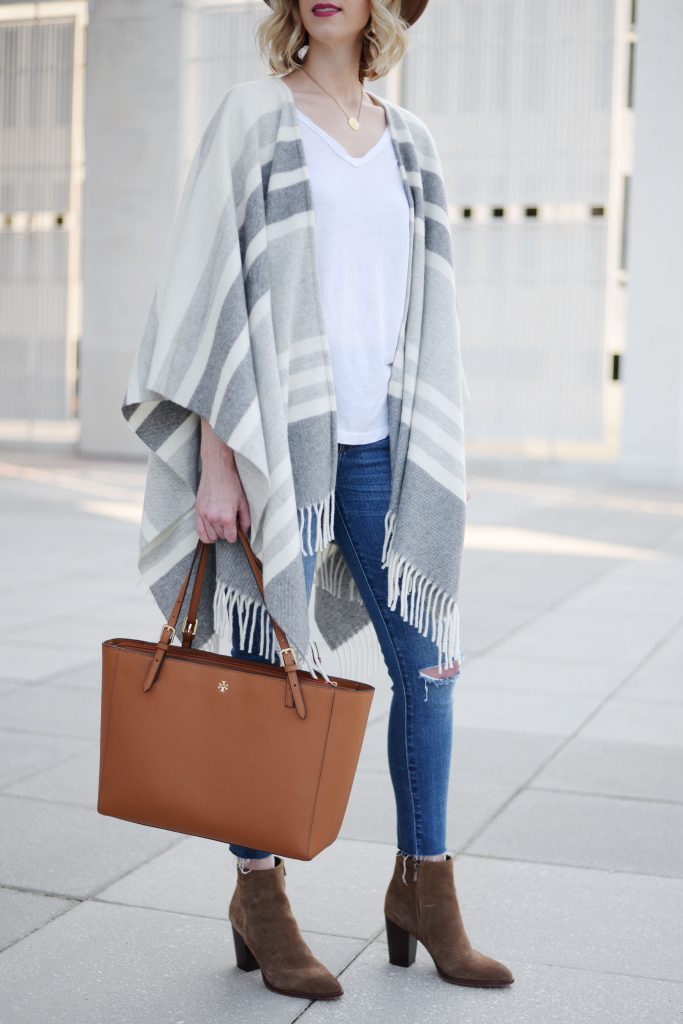 poncho worn with jeans and ankle booties