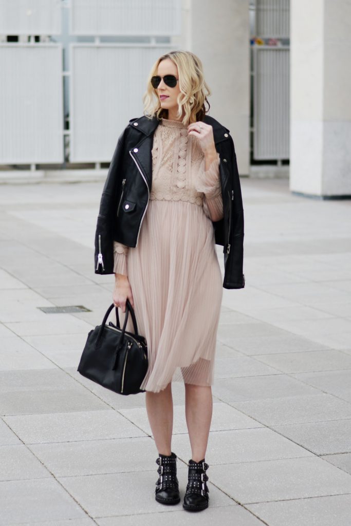 feminine and edgy outfit combination, tulle dress with leather moto jacket and boots