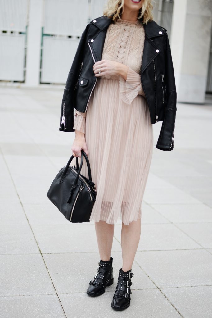 nude tulle overlay dress with edgy black moto jacket and boots