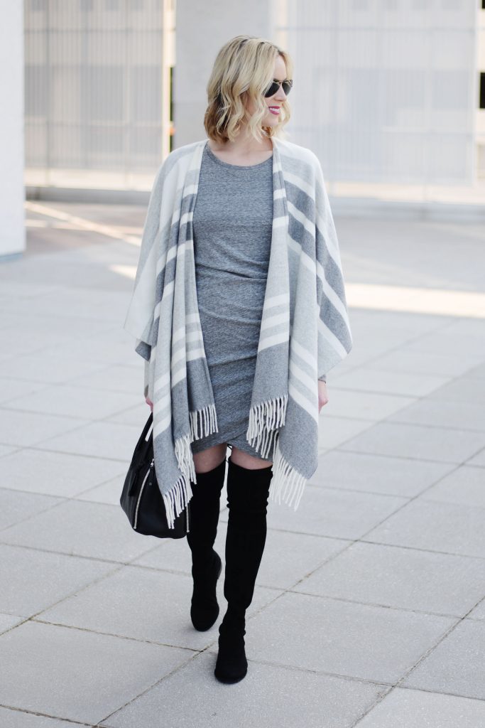 grey ruched dress with black over the knee boots and grey striped poncho