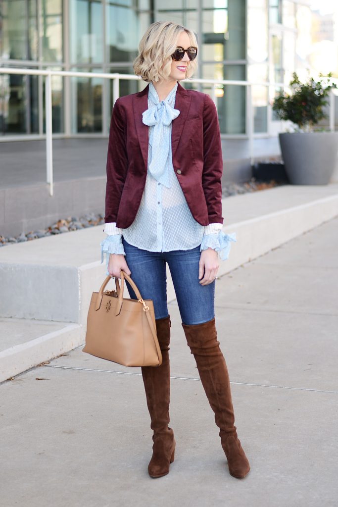 burgundy velvet blazer styled with blouse and over the knee boots, tan tote bag