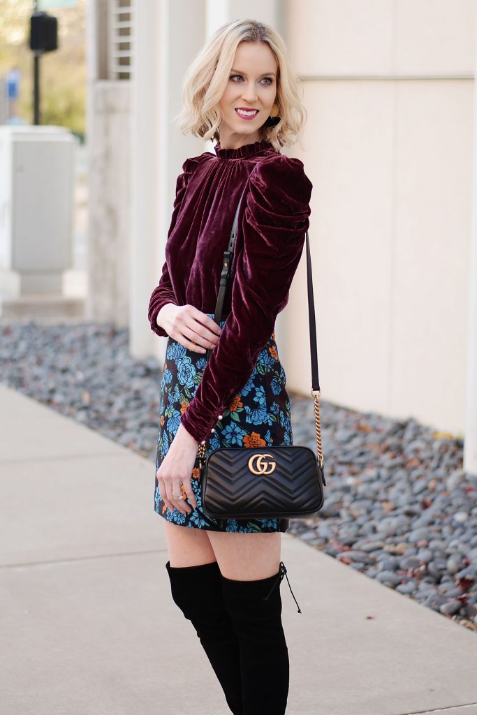 gorgeous wine colored velvet top with puff sleeves and pearl buttons, jacquard floral skirt, gucci marmont bag, black over the knee boots
