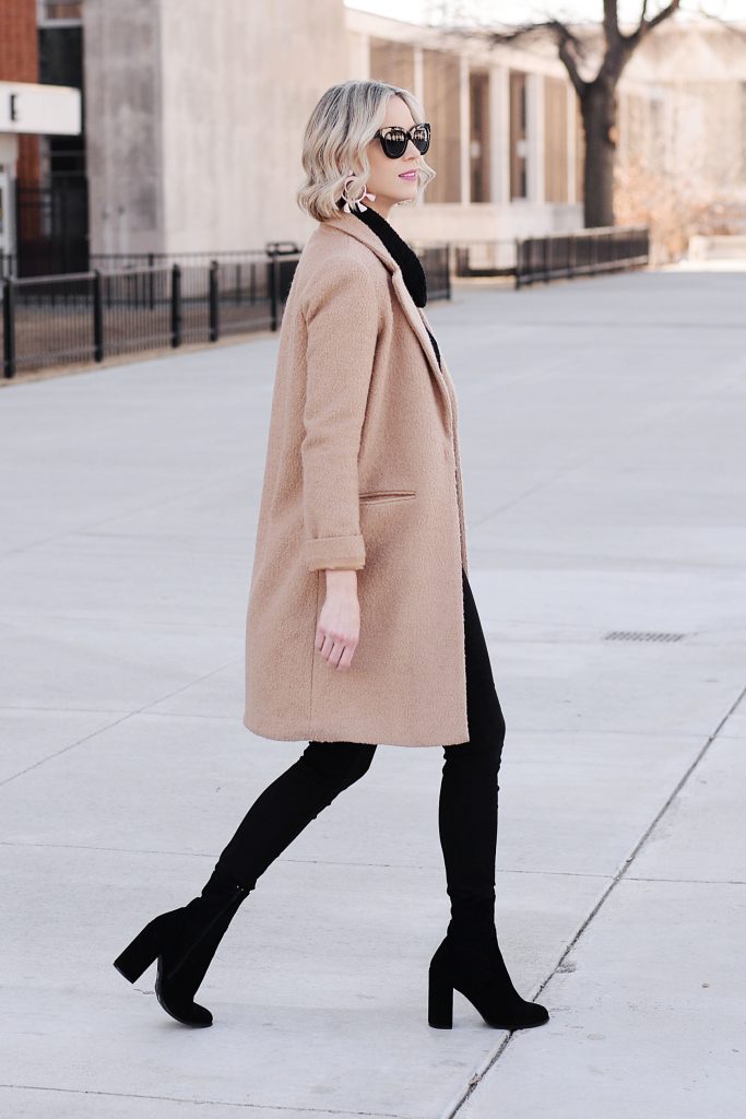 all black outfit with tan topcoat and black sock booties