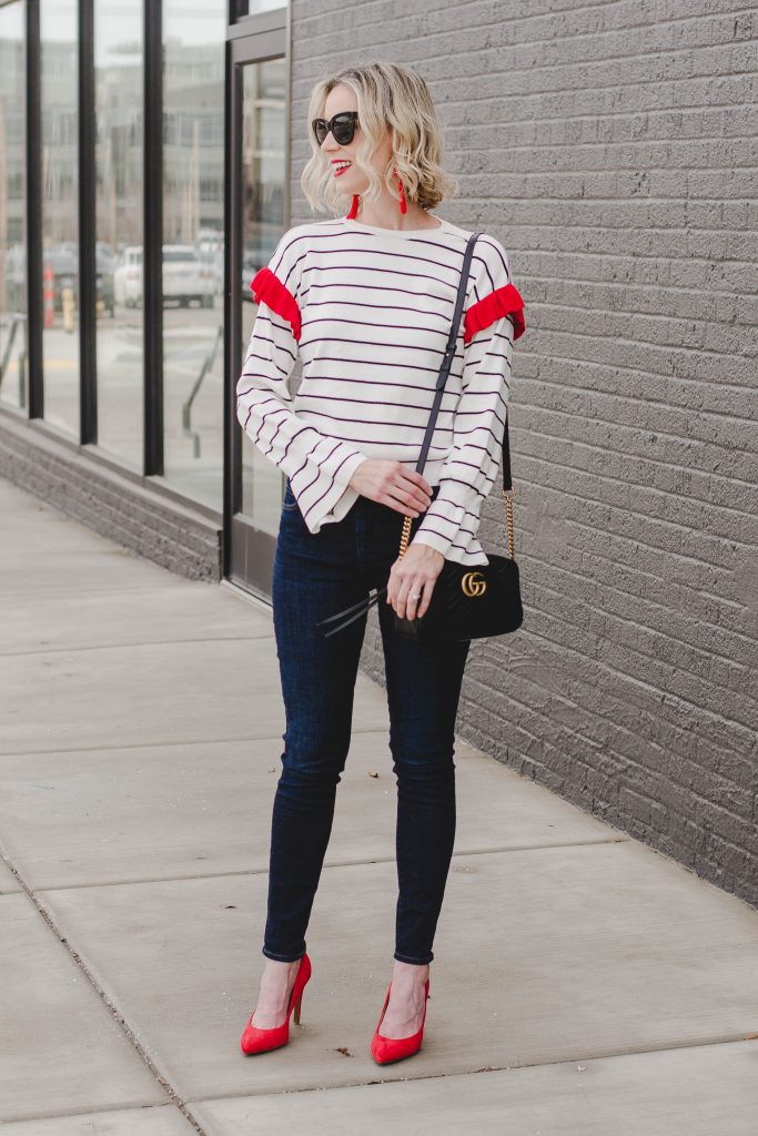 striped top with dark skinny jeans and heels