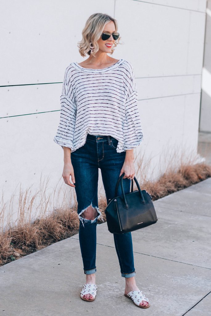 white top with black stripes and white studded sandals