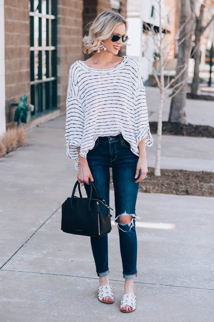 slouchy striped top with busted knee jeans
