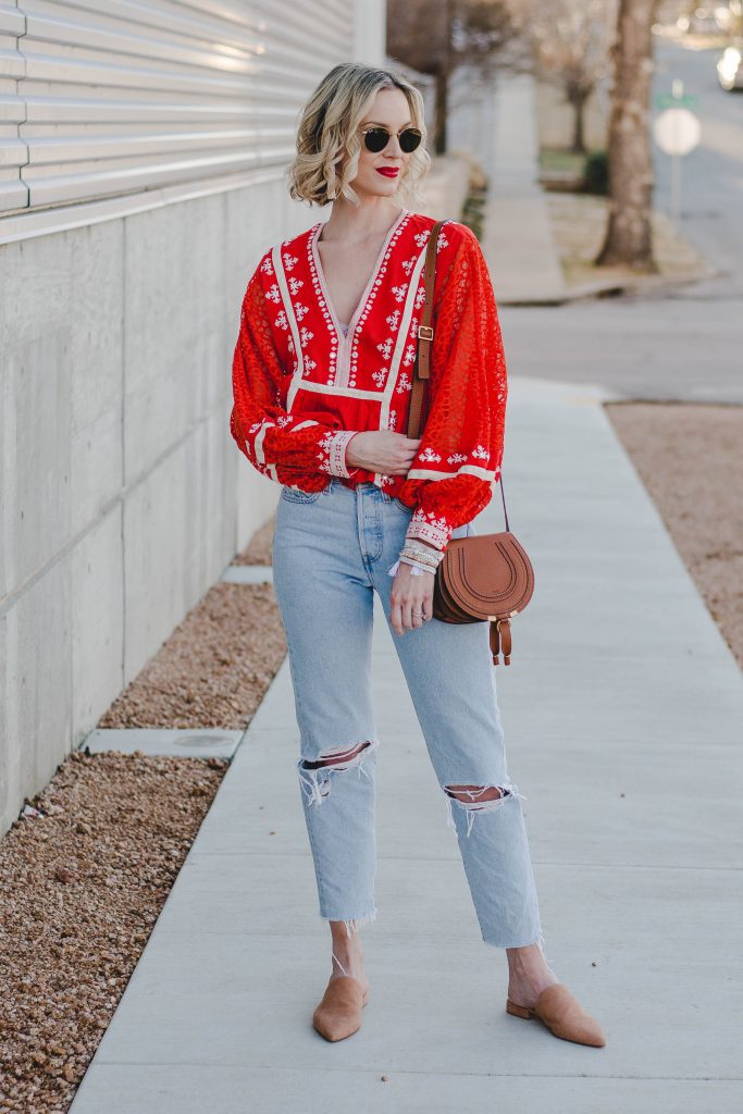red top with pretty detailing, levi's wedgie jeans, tan slides