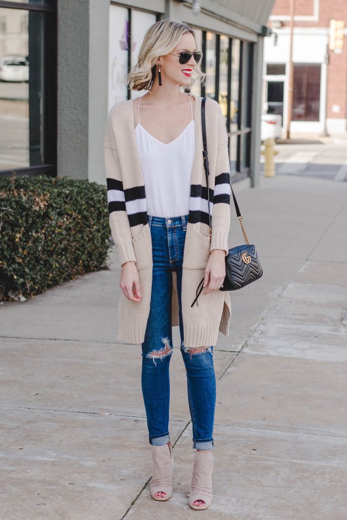 tan, black, and white cardigan with white cami and jeans
