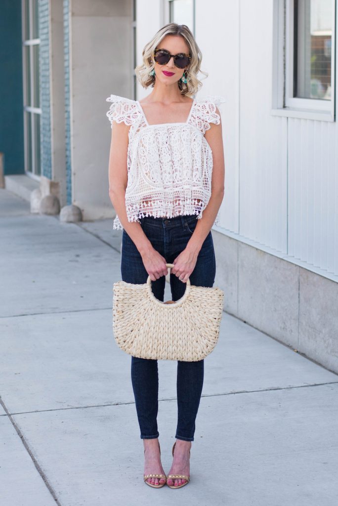 white crochet top with jeans and heels