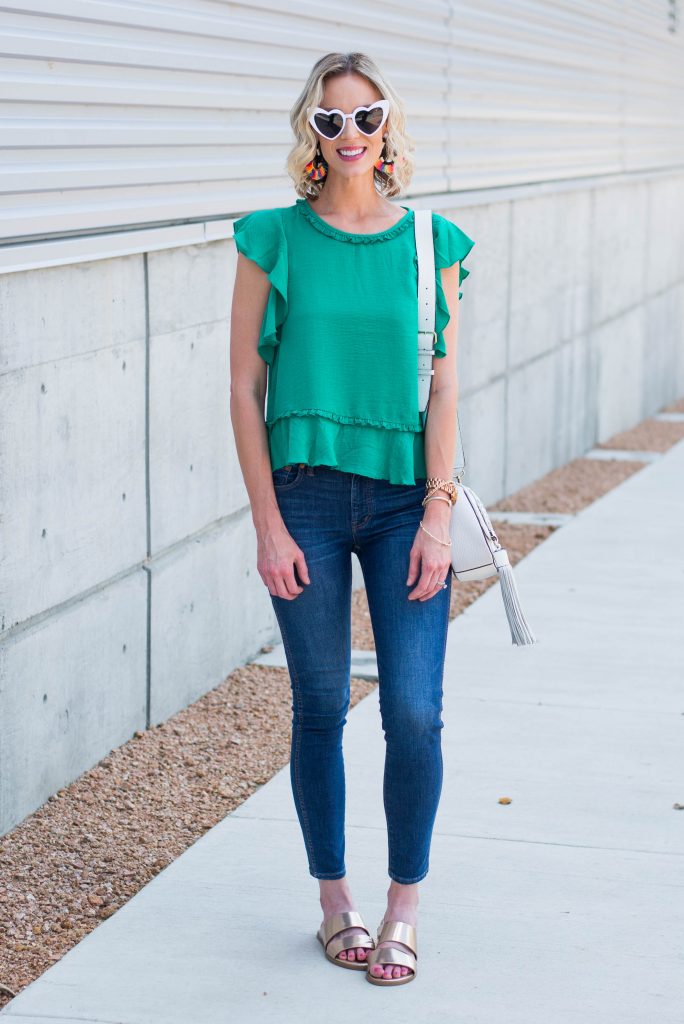 cute green ruffle top, skinny jeans, and gold slides