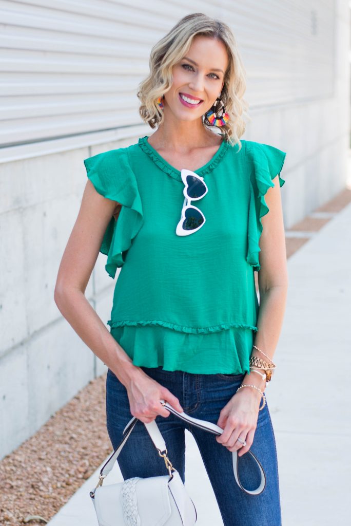 dressy green top with statement rainbow earrings