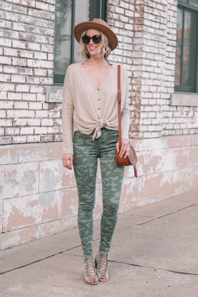 camo jeans styled with a neutral top