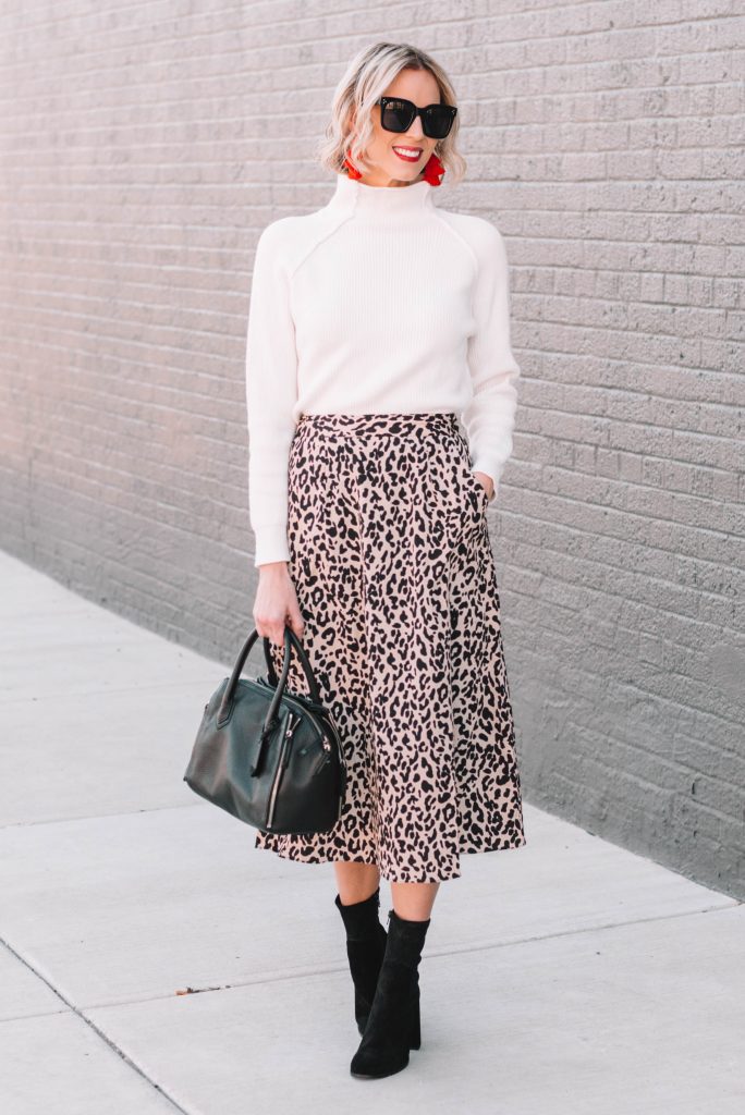 leopard midi skirt with boots and a sweater, stylish work outfit