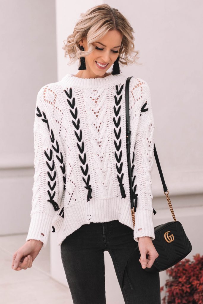 black and white sweater with lace up detailing