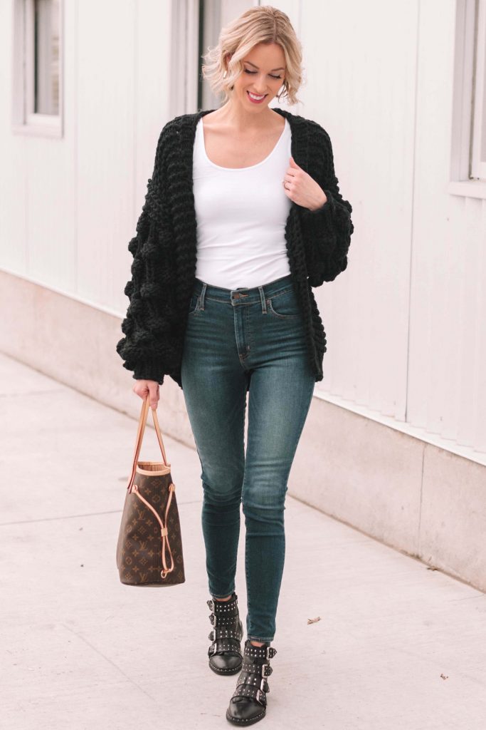 chunky black cardigan and jeans