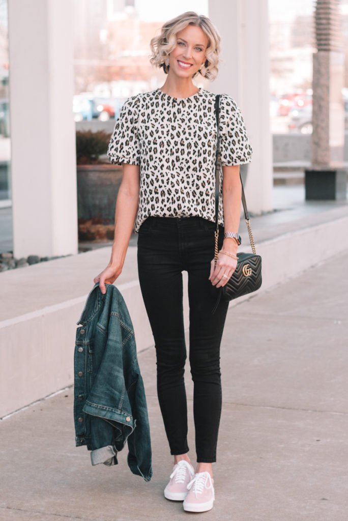 leopard top with black jeans, pink sneakers, jean jacket