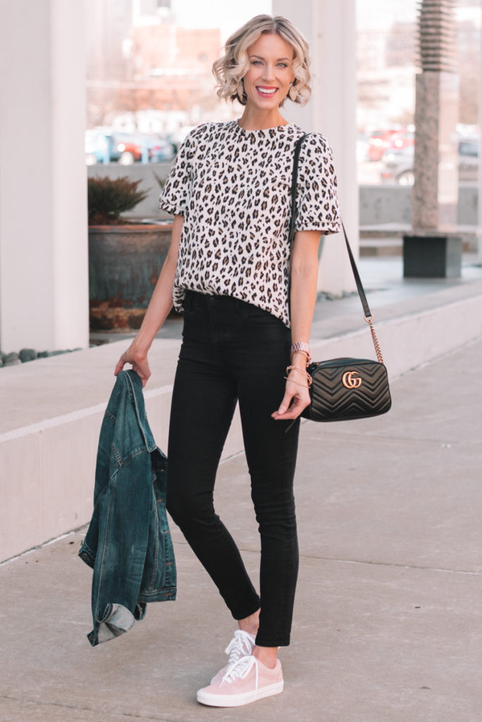 leopard top with black jeans, pink sneakers, jean jacket