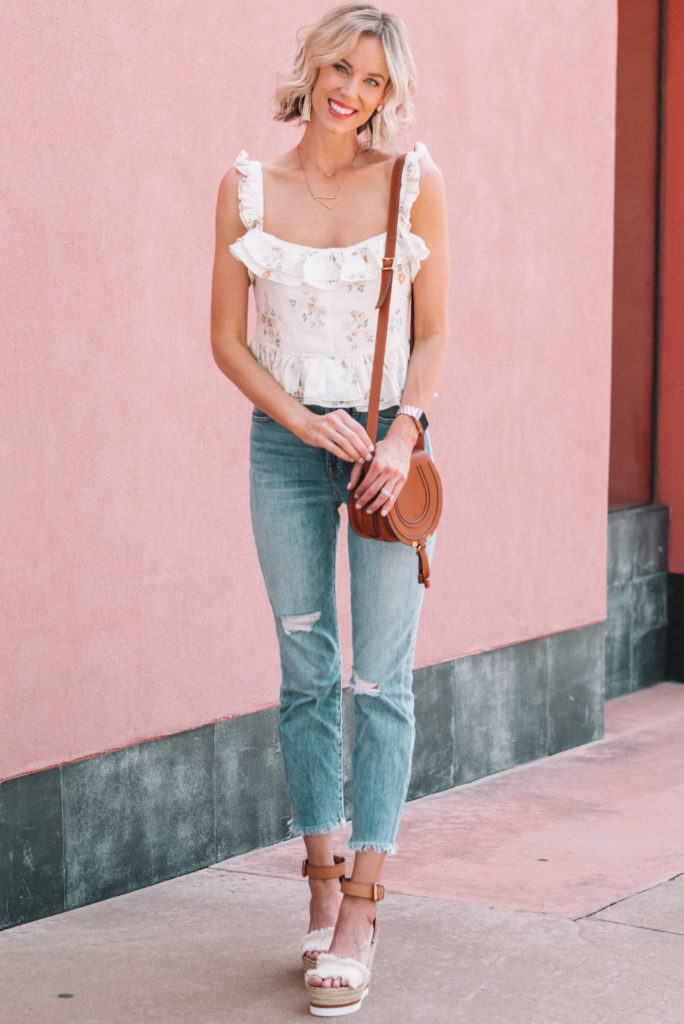 adorable white floral tank top and jeans for spring date night idea