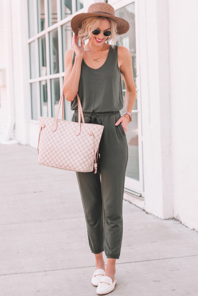 comfy and stylish olive jumpsuit for women, jumpsuit worn with mules and hat for summer
